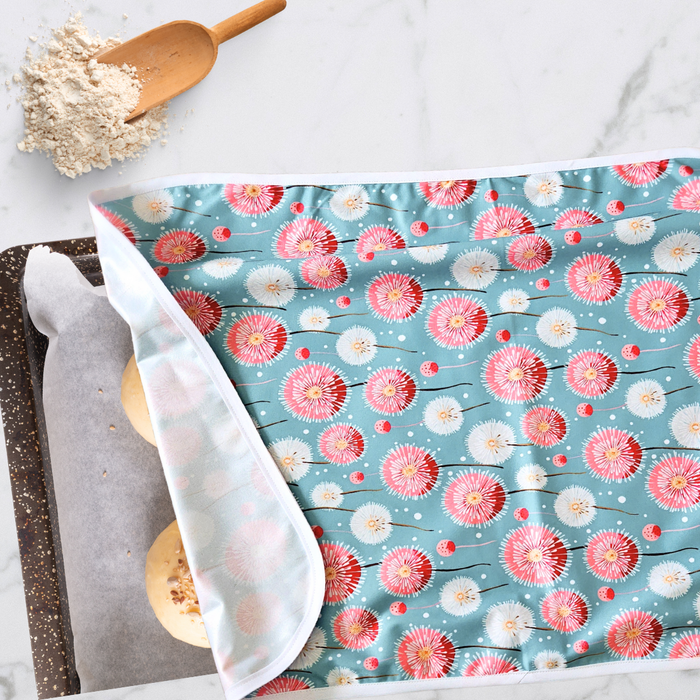 reusable flat sheet proofing cover with a vibrant dandelion print