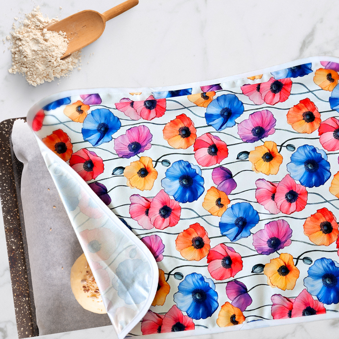 Reusable XL proofing cover with vibrant red poppy flower print, perfect for sourdough rising and eco-friendly baking. Covers cookie sheets and sheet pans perfectly.