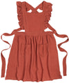 Shop the Danica Heirloom Ada Apron in Sumac. Made from soft 100% cotton with vintage-inspired ruffled straps, pockets and an adjustable fit.  The perfect homesteading apron