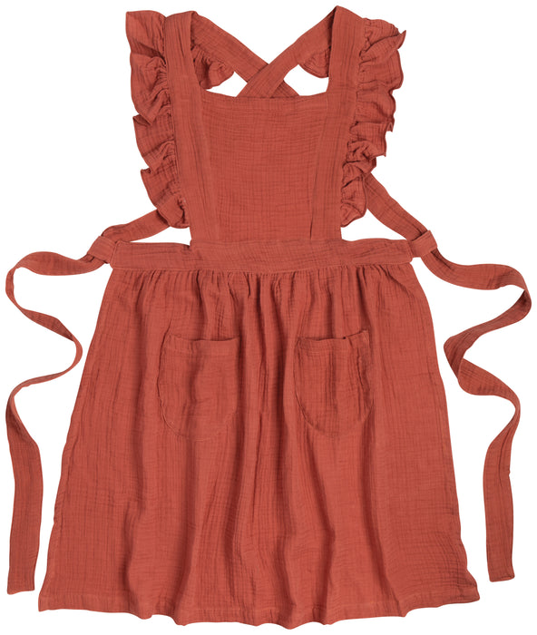 Shop the Danica Heirloom Ada Apron in Sumac. Made from soft 100% cotton with vintage-inspired ruffled straps, pockets and an adjustable fit.  The perfect homesteading apron