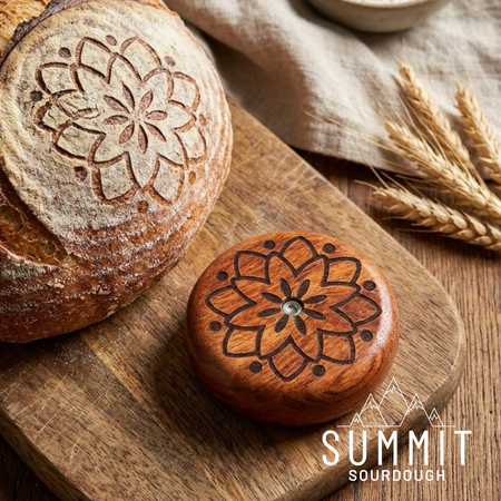 All wood UFO style sourdough bread lame, with a lotus print on the front.