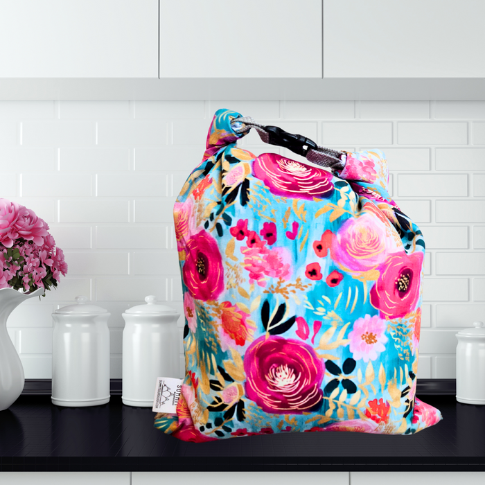 Bright garden bread bag with gold accents—eco-friendly and reusable for artisan bread, bagels, or rolls.
