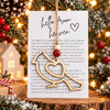 Wooden cardinal memorial Christmas ornament with Hello From Heaven story card, a remembrance gift symbolizing love and connection to a loved one who has passed.