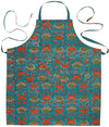 Danica Heirloom Allure hand block print cotton baking apron displayed with coordinating kitchen linens.