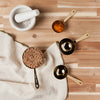 Danica Heirloom Gold Measuring Cups Set of 4 measuring baking ingredients for sourdough and homemade recipes.
