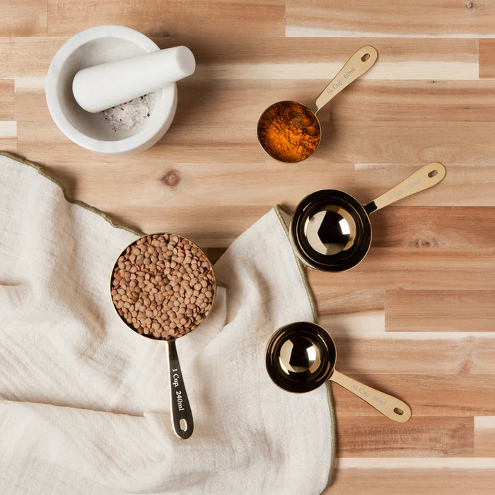 Danica Heirloom Gold Measuring Cups Set of 4 measuring baking ingredients for sourdough and homemade recipes.
