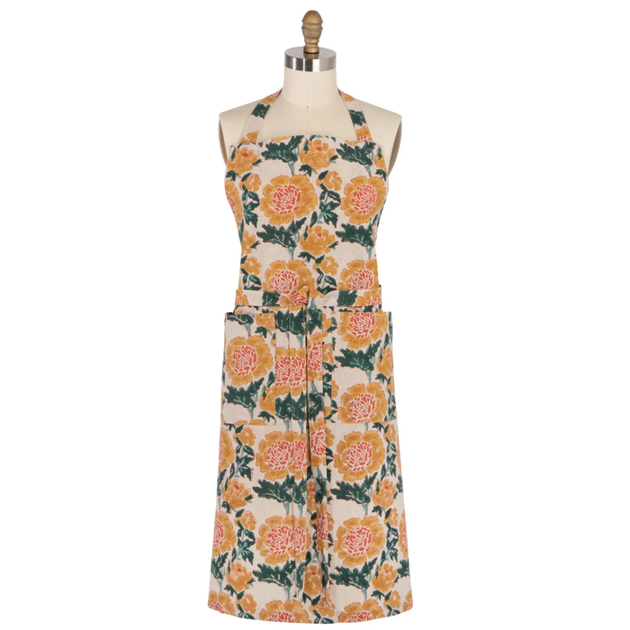 Danica Heirloom Goldenrise Block Print Apron featuring a handcrafted floral botanical pattern, adjustable shoulder straps, and two front pockets. Perfect for cooking and sourdough bread baking.