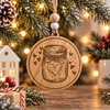 Dark wood sourdough starter Christmas ornament with a laser-engraved mason jar, heart design and decorative hearts, hanging from twine with wooden beads and Christmas lights.