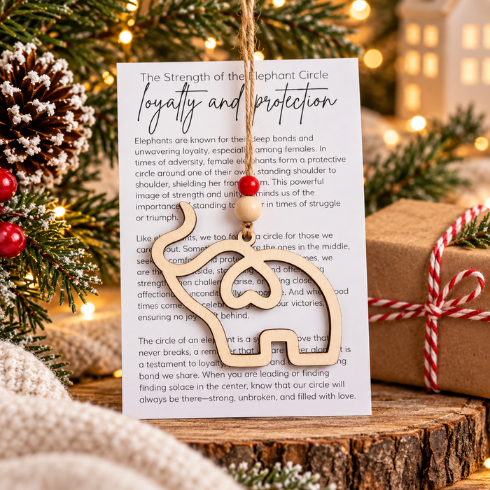 Wooden elephant Christmas ornament with Strength of the Elephant Circle loyalty and protection story card, a meaningful gift symbolizing family, friendship and support.