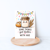 Cute bread-themed birthday card with sourdough starter, wheat stalks, and colorful bunting in a lifestyle mockup.