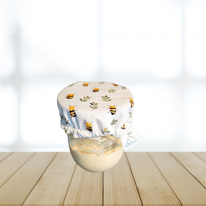 Eco-friendly fabric cover on a sourdough starter jar
