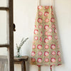 Close-up of the Danica Heirloom Zinnia hand block print cotton fabric featuring blush floral blooms and green vines.