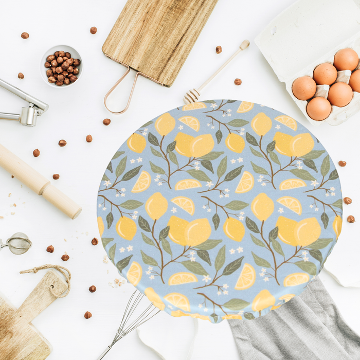 Lemon Citrus kitchen print reusable sourdough bowl cover with lemon tree branches and citrus slices on a light blue background, extra large size fits oval brotforms and large KitchenAid mixer bowls for proofing dough