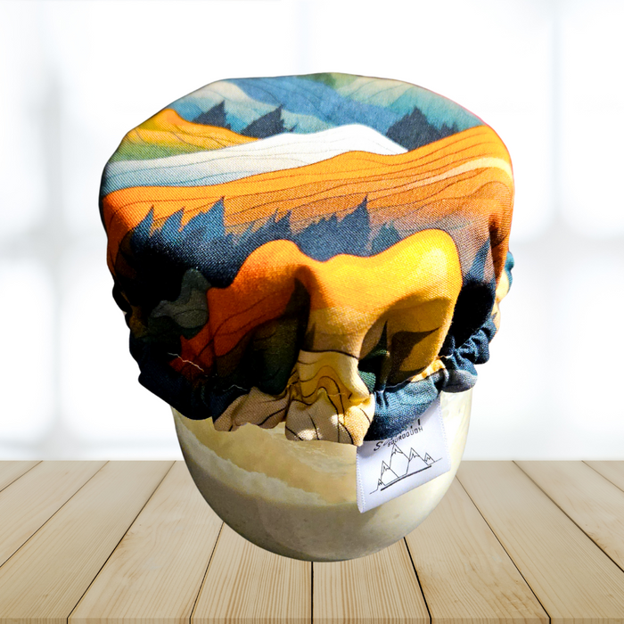 Mountain print cloth cover on a sourdough starter jar