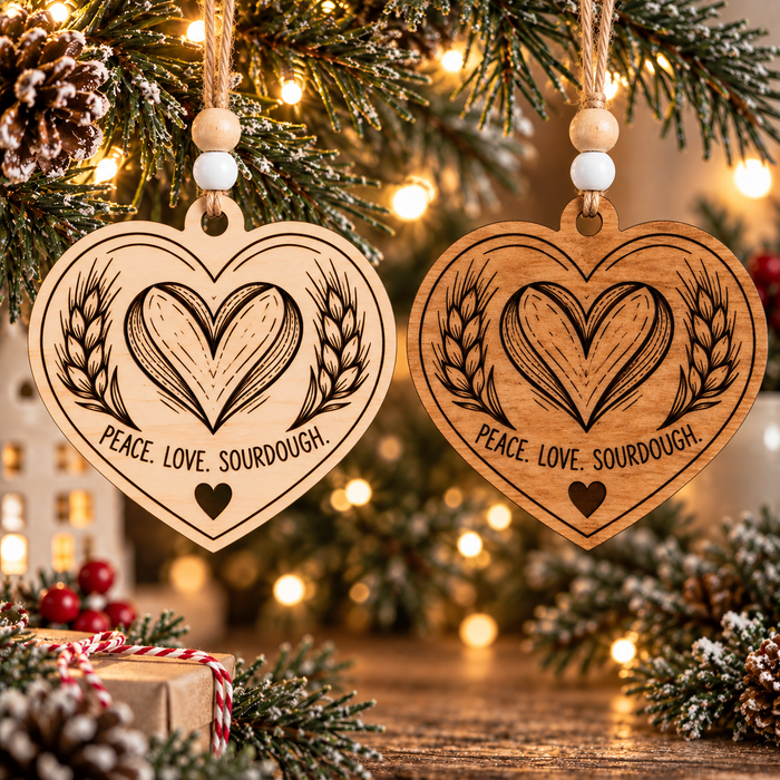 Peace Love Sourdough wooden heart ornament shown in natural and stained wood finishes