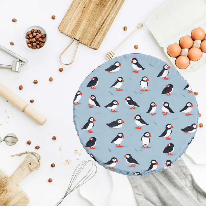 A puffin themed dough proofing cover, suitable for use as a reusable bowl cover, a banneton cover or brotform cover.  Non stick