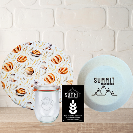 Sourdough bread themed 4 piece artisan bakers kit including a weck jar, sourdough starter, reusable bowl cover and boule brotform.