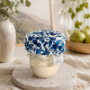 Reusable sourdough jar cover with blueberry floral pattern on glass starter jar