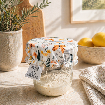 Reusable sourdough jar cover with butterfly and botanical pattern on glass jar