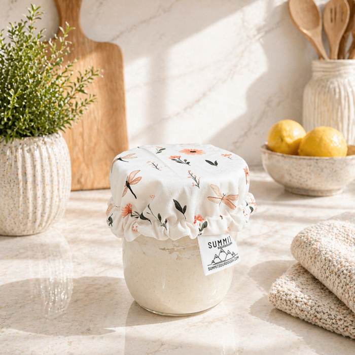 Reusable sourdough jar cover with dragonfly and floral pattern on starter jar