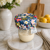 Reusable sourdough jar cover with navy floral pattern on sourdough starter jar