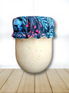 Reusable cloth cover on a sourdough starter jar