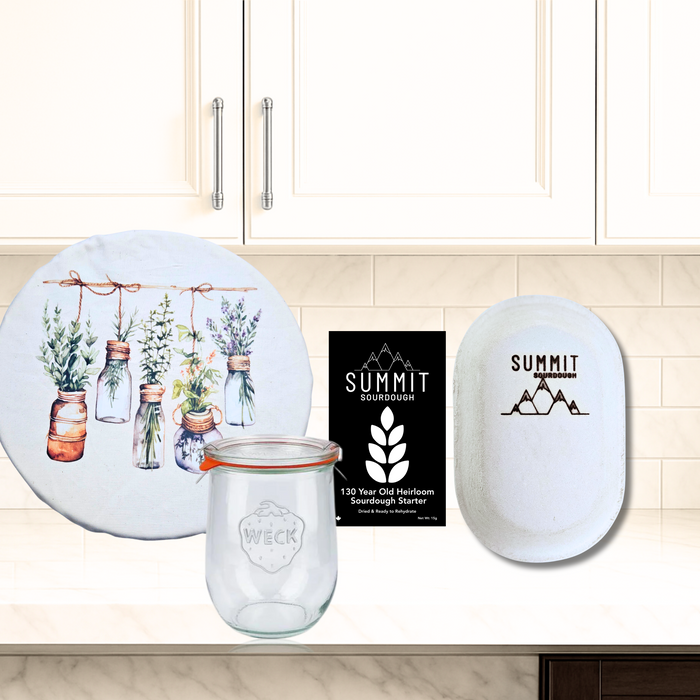Made in Canada Sourdough Starter kit which includes a proofing basket, sourdough starter and weck jar, and apothecary themed brotform banneton cover.